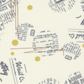 Celestial News Dropping Moonbeam fabric by Zen Chic for Moda Fabrics, with charcoal newsprint motifs and mustard-gold dots on ivory.