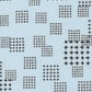 Close-up of Lazy Afternoon Sky Fabric by Zen Chic for Moda Fabrics, with black cross-shaped marks arranged in scattered grids on pale blue.