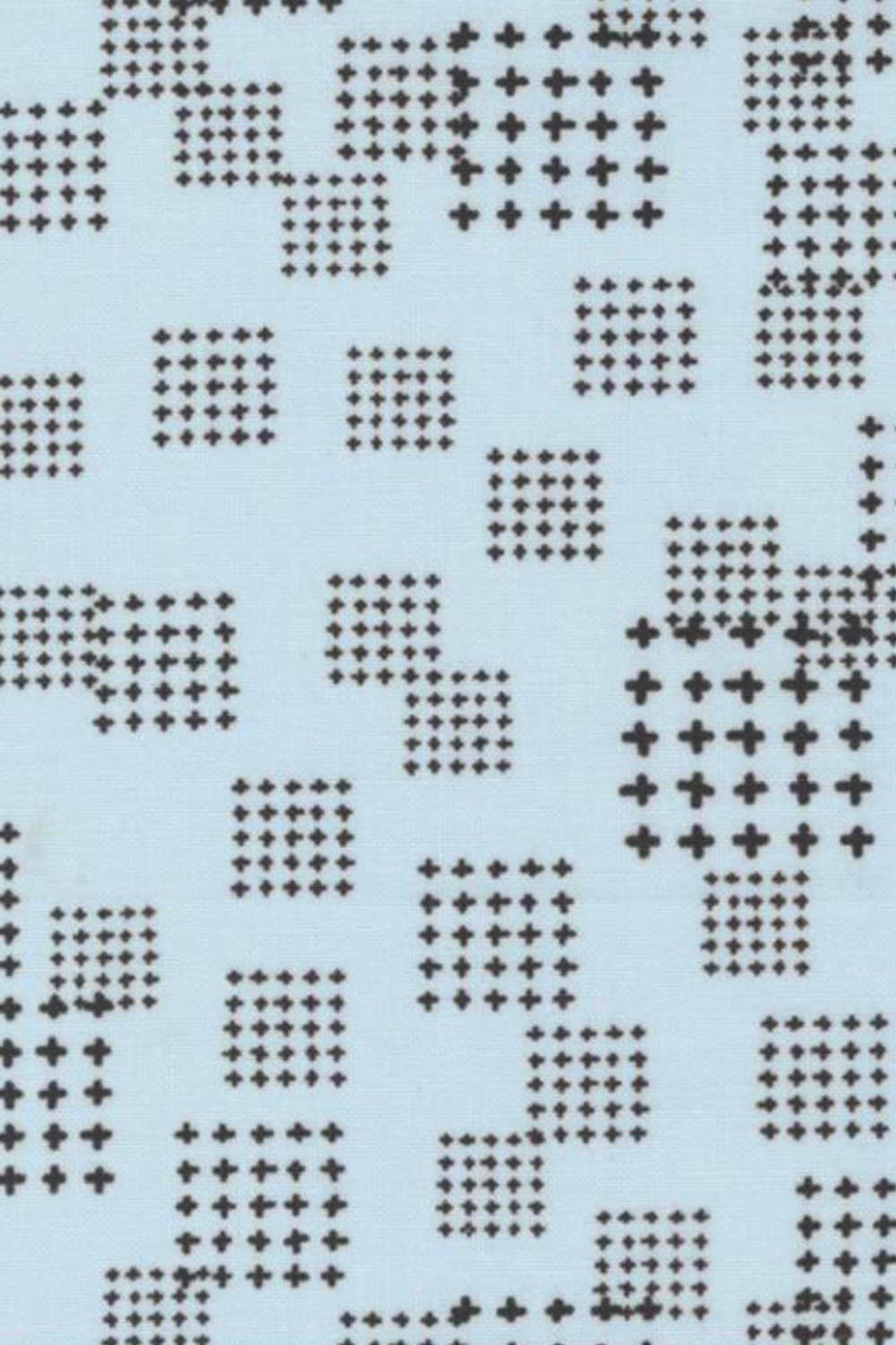 Close-up of Lazy Afternoon Sky Fabric by Zen Chic for Moda Fabrics, with black cross-shaped marks arranged in scattered grids on pale blue.