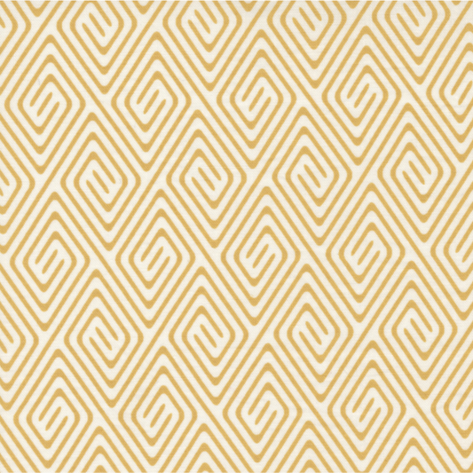 Lazy Afternoon Golden fabric by Zen Chic for Moda Fabrics, showing a golden geometric maze and spiral print on a cream ground, beside a ruler for scale.