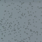 Close-up of Modern Background Even More Paper Steel Crosshatch Bolt B fabric by Zen Chic for Moda Fabrics, with scattered dark crosshatch marks on a muted steel blue-gray background.