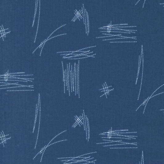 Close-up of Bluish Stitched Up Blueprint fabric by Zen Chic, featuring pale stitched lines and crosshatches on a blueprint-blue ground.