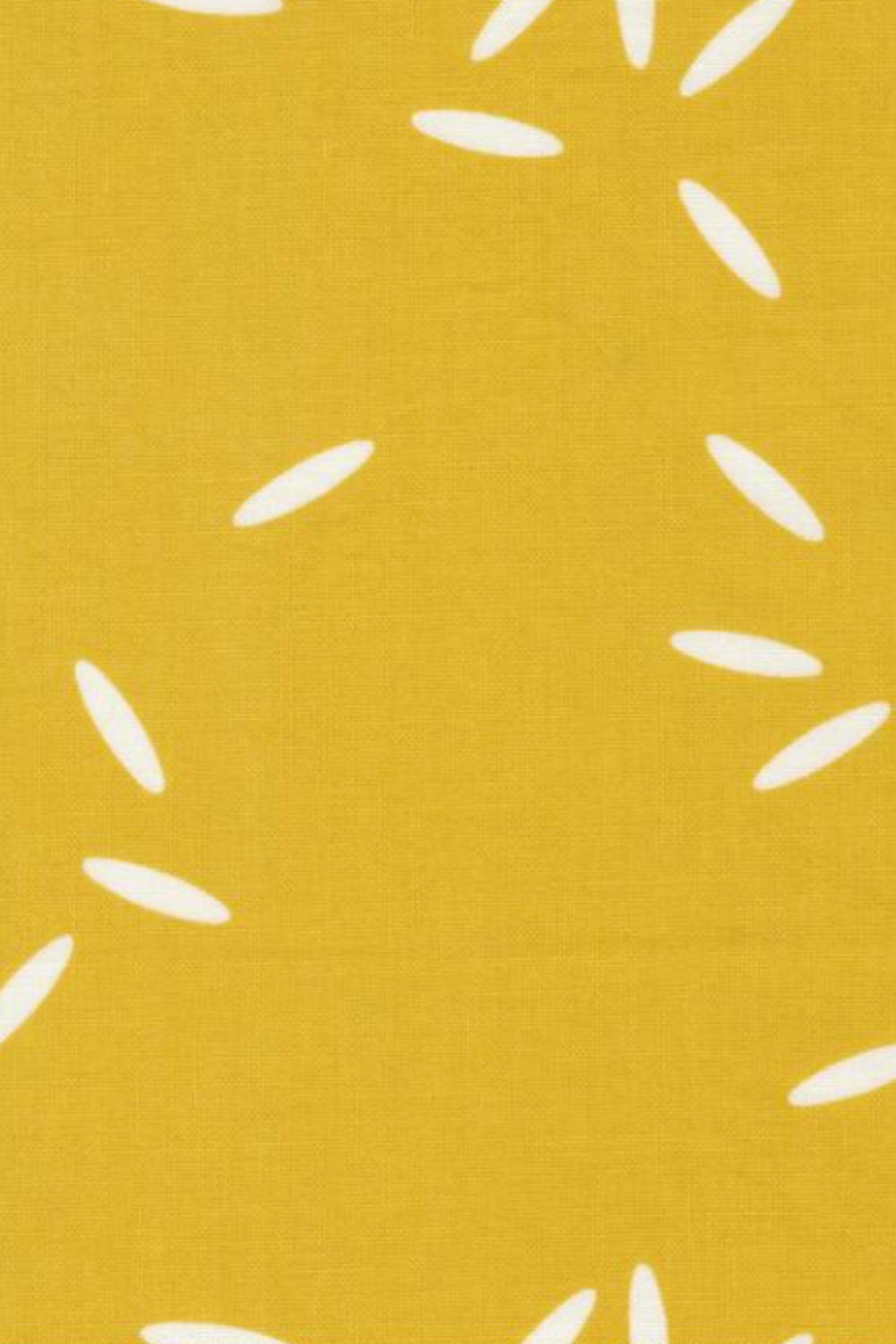 Close-up of Filigree Rice Saffron fabric by Zen Chic for Moda Fabrics showing white rice-grain shapes on a saffron-mustard ground