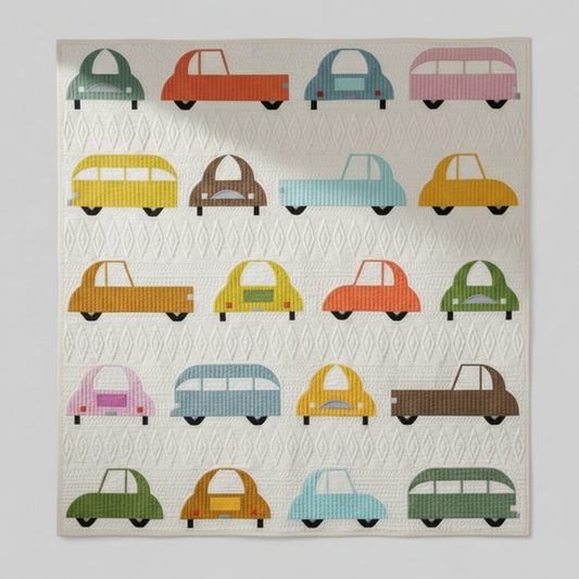 Quilt with colorful car patterns on a white background