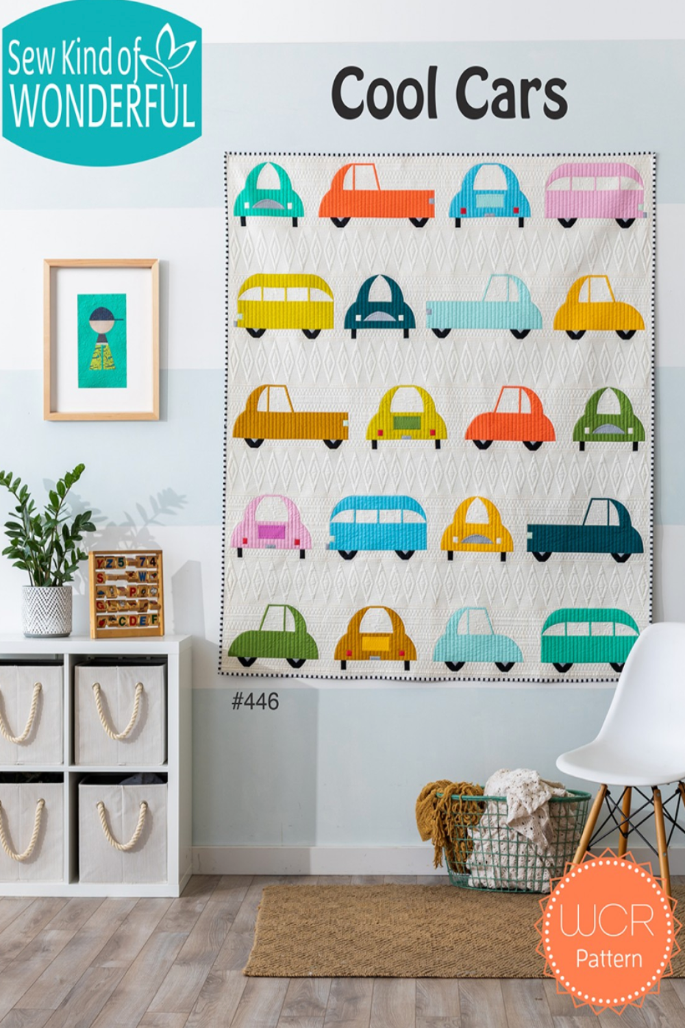 Colorful car pattern quilt hanging on a wall with 'Sew Kind of Wonderful' branding.