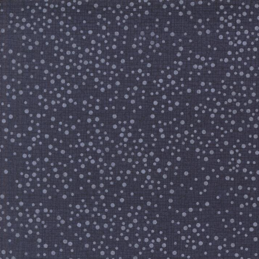 Dotty Thatched Indigo quilting cotton fabric by Robin Pickens for Moda Fabrics — deep indigo-charcoal ground with scattered tonal grey dots. 100% cotton, 43–44" wide. Available at IraRobi Quilts.