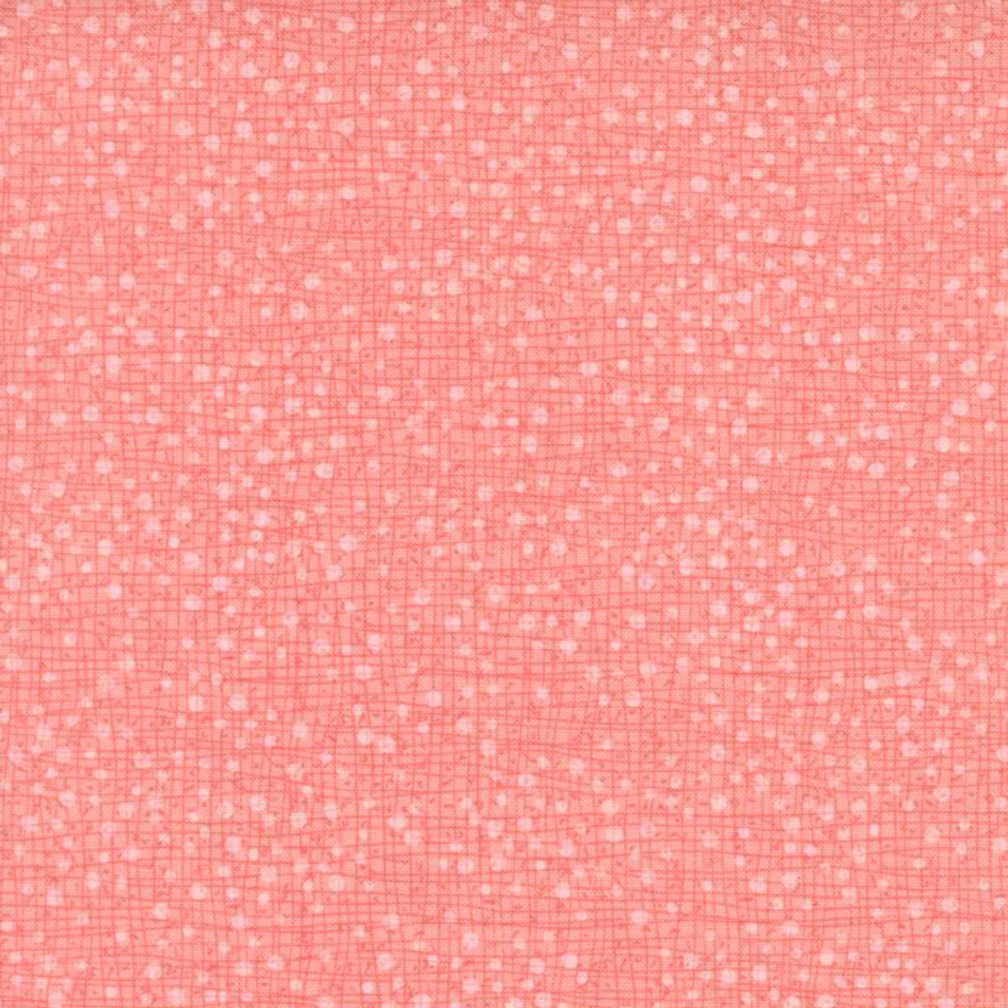 Dotty Thatched Carnation quilting cotton by Robin Pickens for Moda Fabrics — close-up showing the warm coral-pink ground with scattered tonal dots and crosshatch texture detail. 100% cotton. Available at IraRobi Quilts.