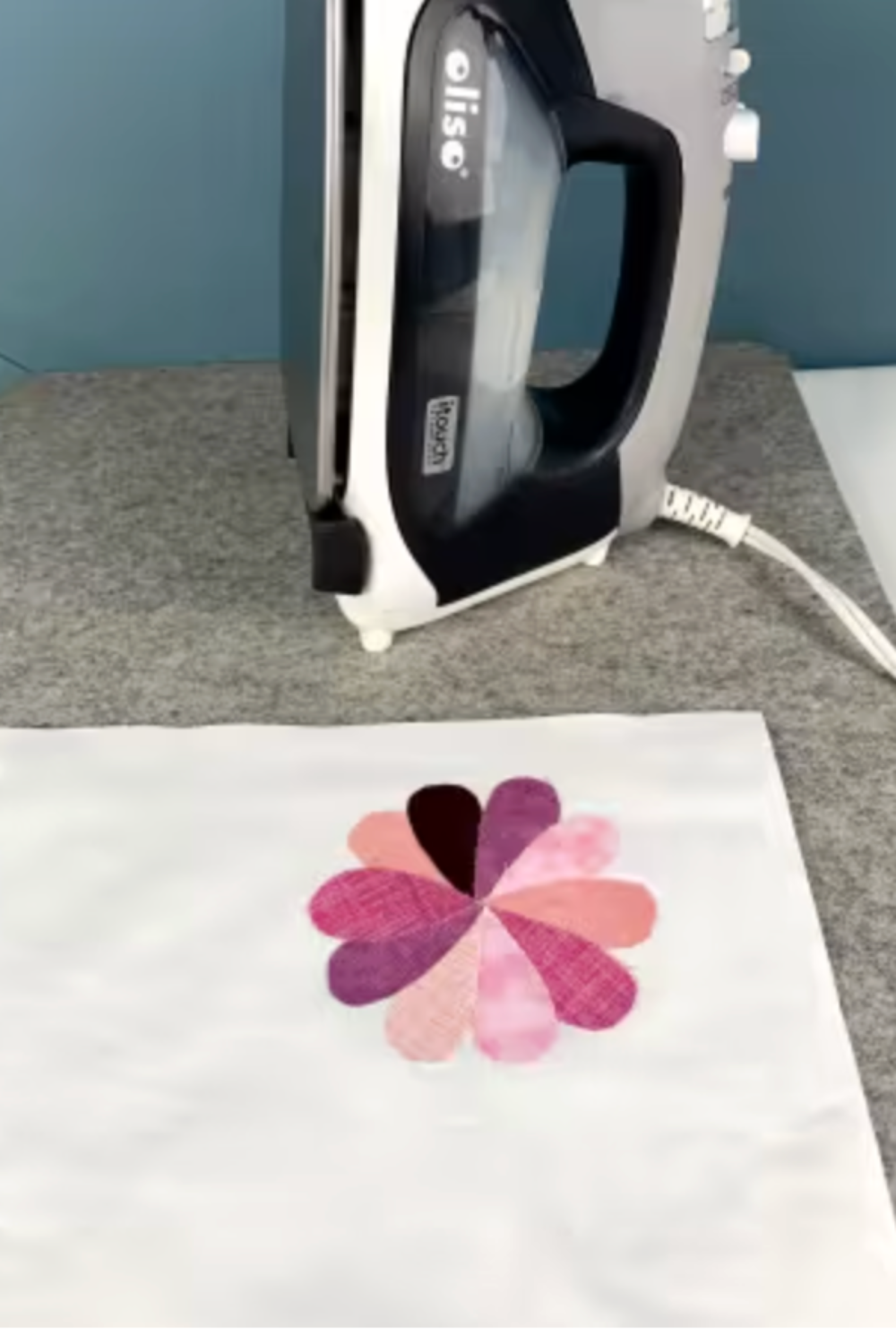 Finished fused appliqué design removed from Silicone Appli-Fuse Mat after pressing.