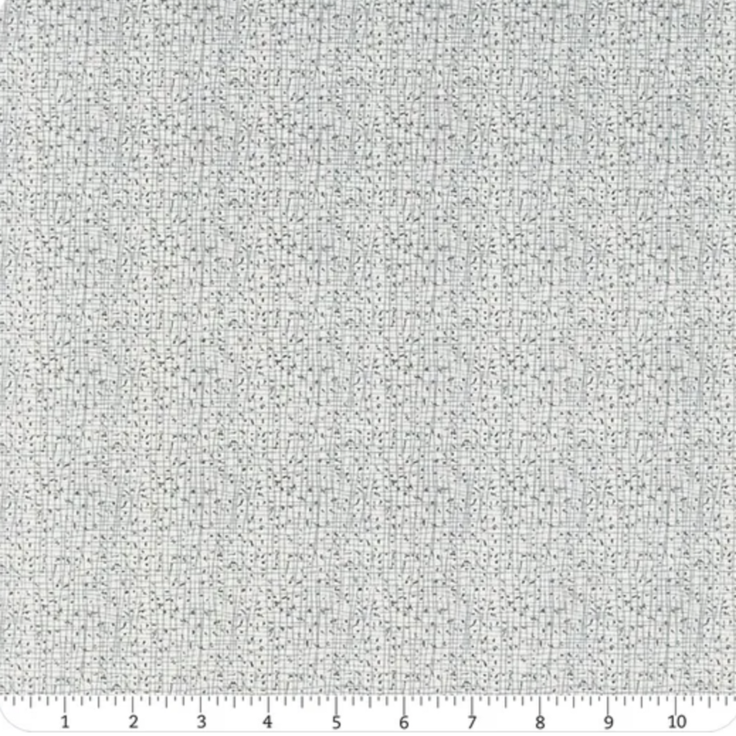 Textured gray fabric pattern with a ruler at the bottom for scale.