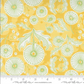 Fabric with green floral pattern on a yellow background, featuring a ruler for scale.