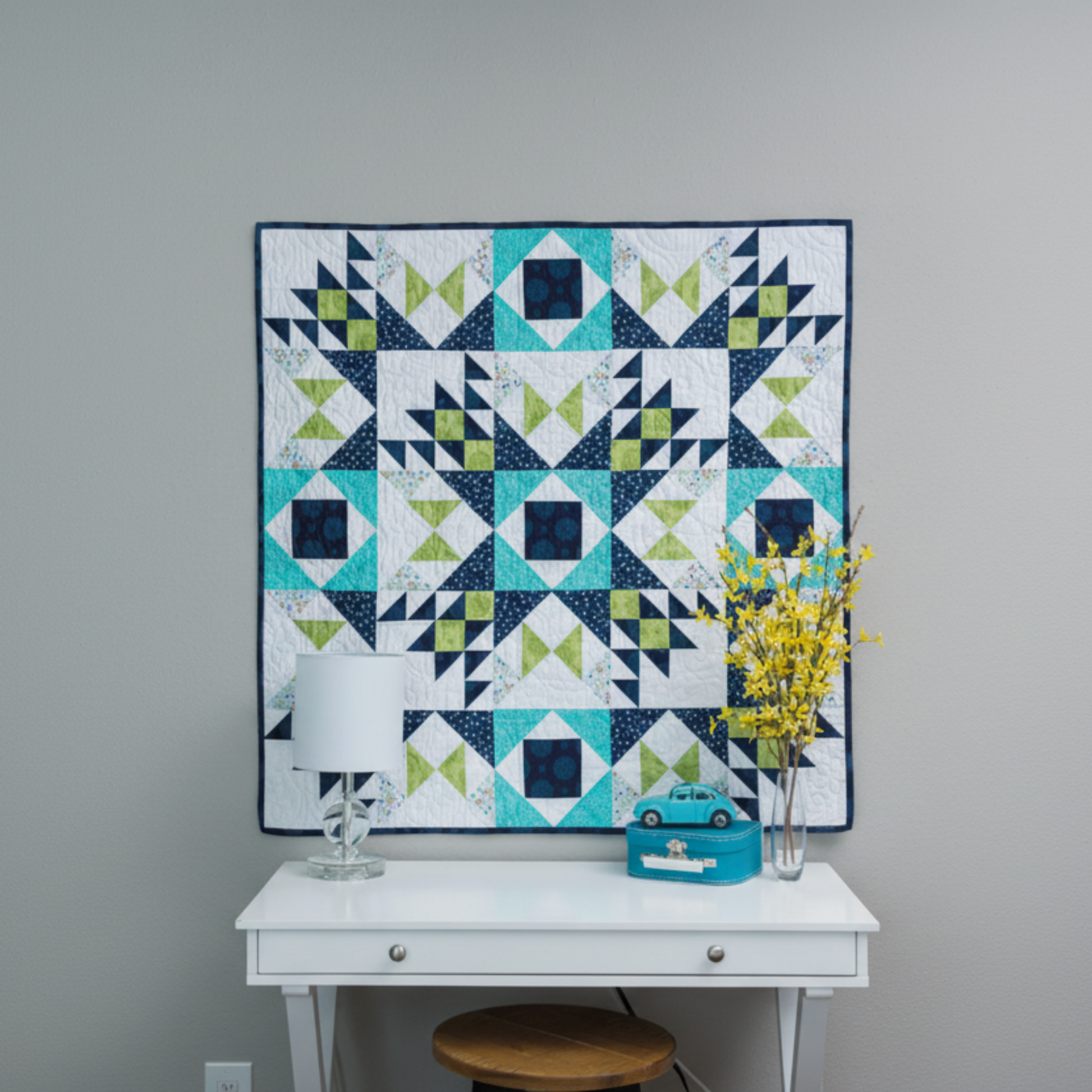 Barn star quilt wall hanging – modern star sampler quilt displayed above table