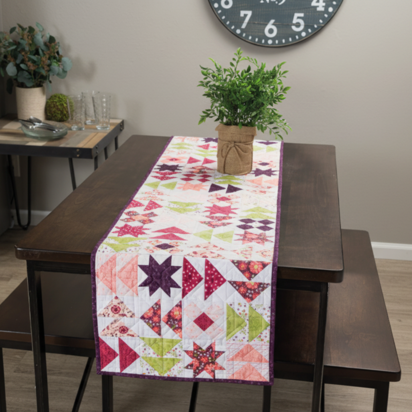 Barn star quilt table runner – star block runner on dining table with floral centerpiece