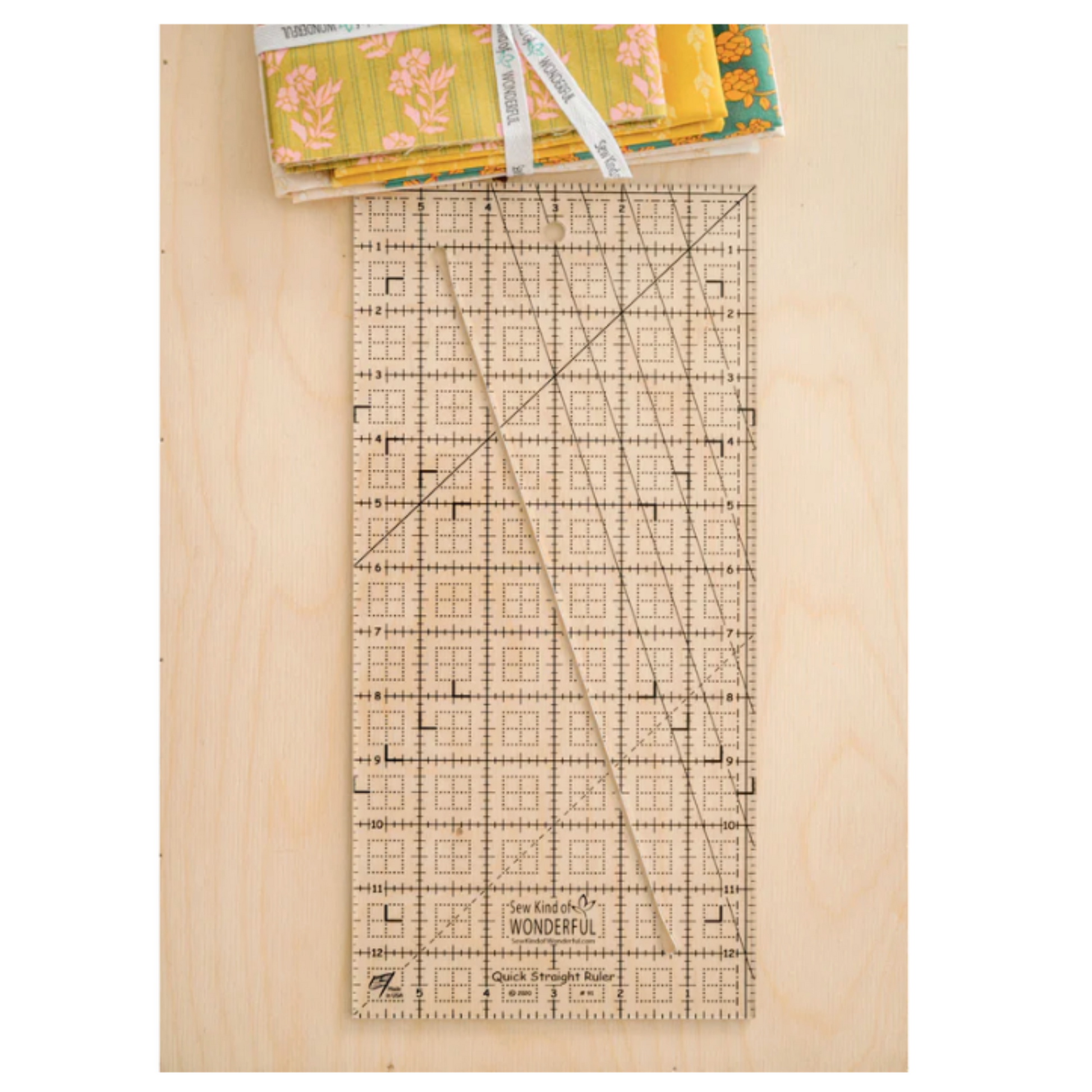 Acrylic quilting ruler 6x13 with angled cut line – precision cutting tool on wooden background