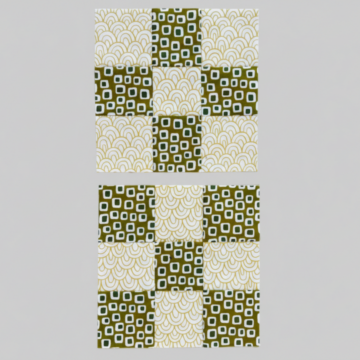 Fabric strips arranged for nine patch quilting – green and white patterned pieces ready for sewing