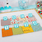 AlphaClippies alphabet and number marking clips organizing fabric swatches on quilting design board workspace