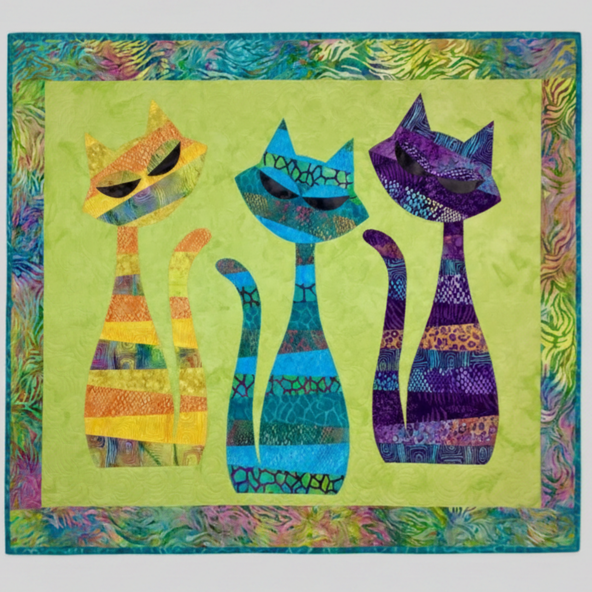 Colorful ModCat cat applique quilt featuring three stylized cats with bright batik fabrics and decorative border