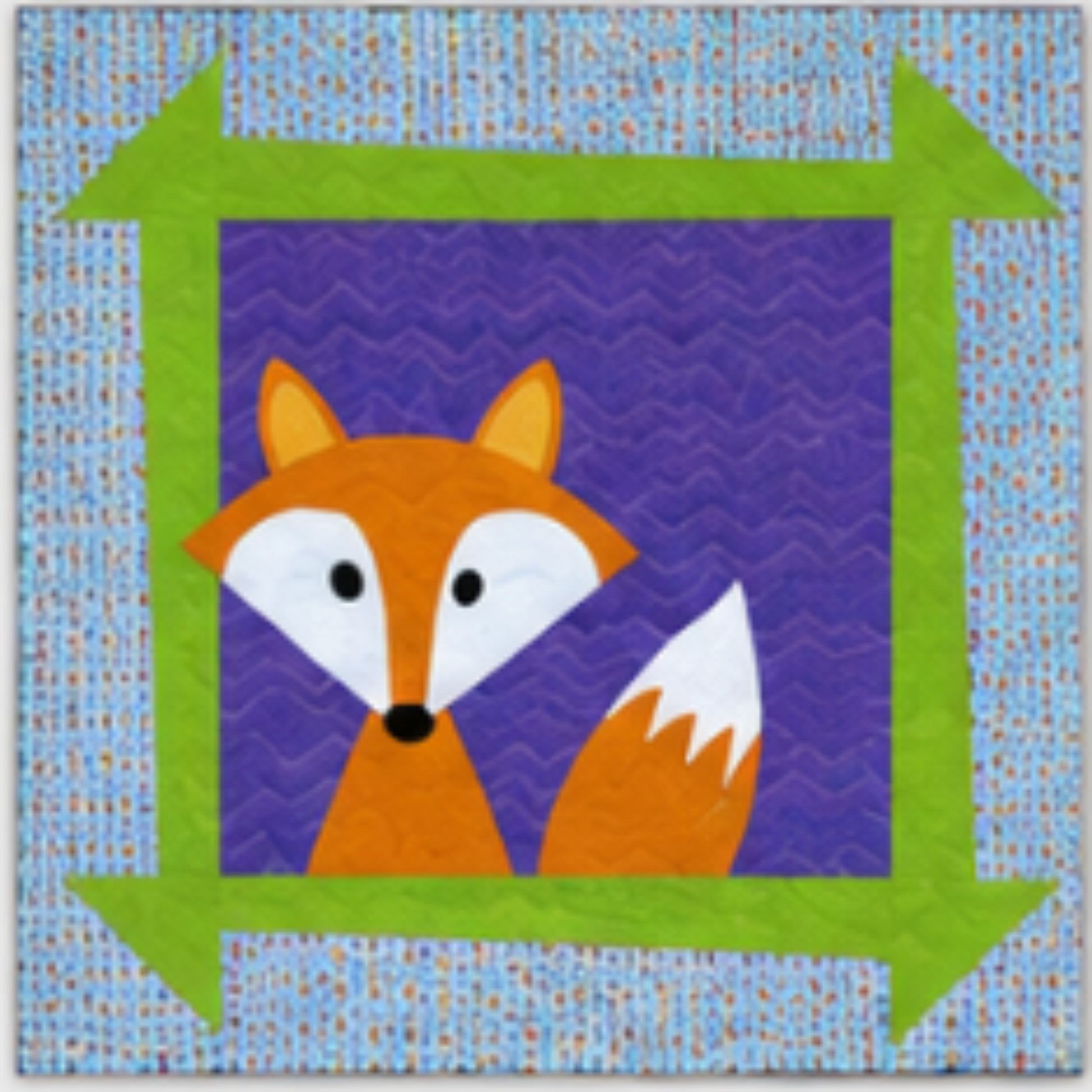 Fox applique quilt block with orange fox design in green arrow border on purple background for baby quilt pattern