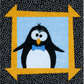 Penguin applique quilt block with black and white penguin design framed by yellow arrow border on dotted black background