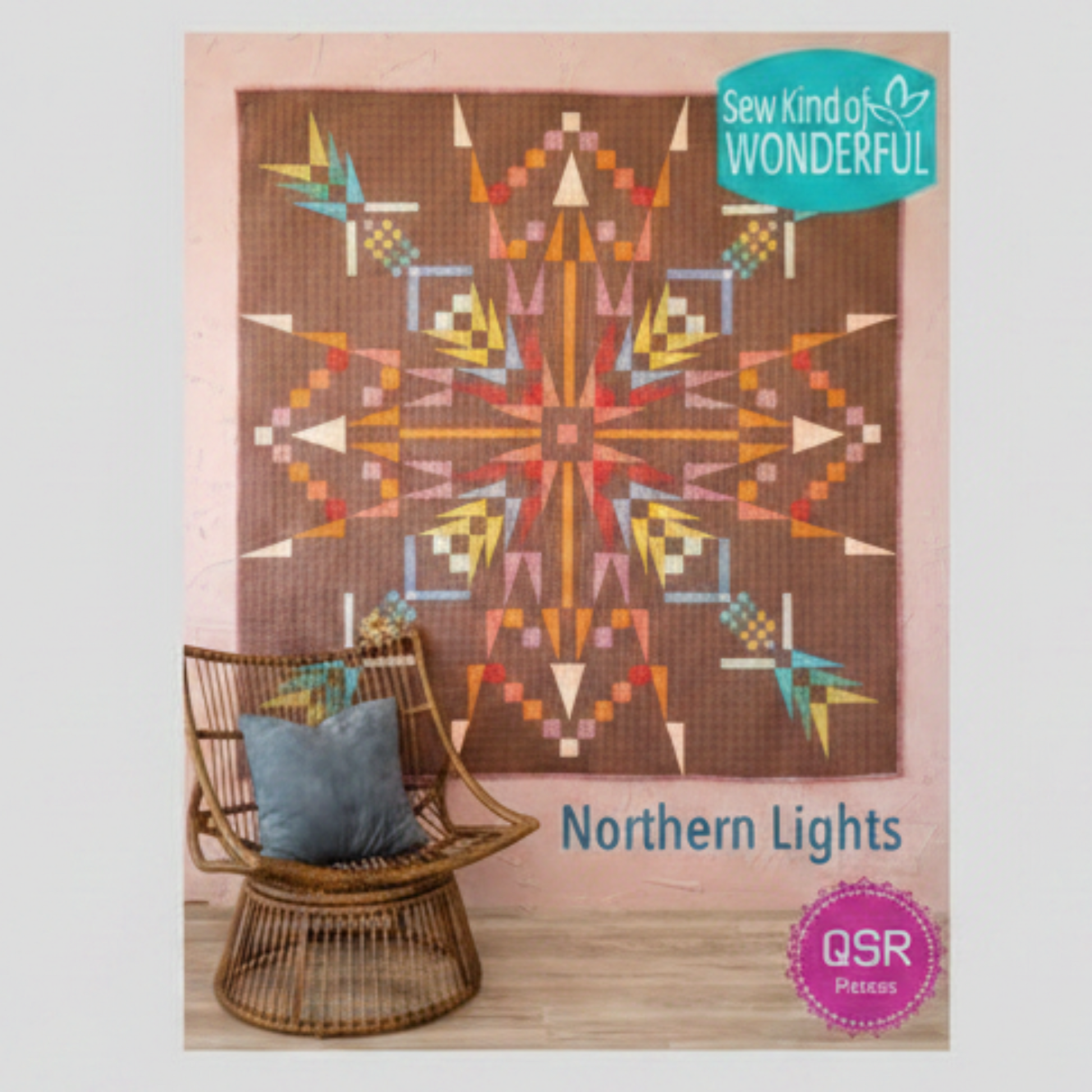 Northern Lights quilt pattern cover featuring a colorful geometric quilt with southwestern-inspired starburst design on brown background beside a wicker chair