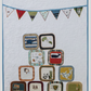 T-shirt quilt project made with children’s clothing and colorful appliqué banner design