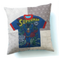 Decorative pillow made from a vintage Superman T-shirt with patchwork background fabrics