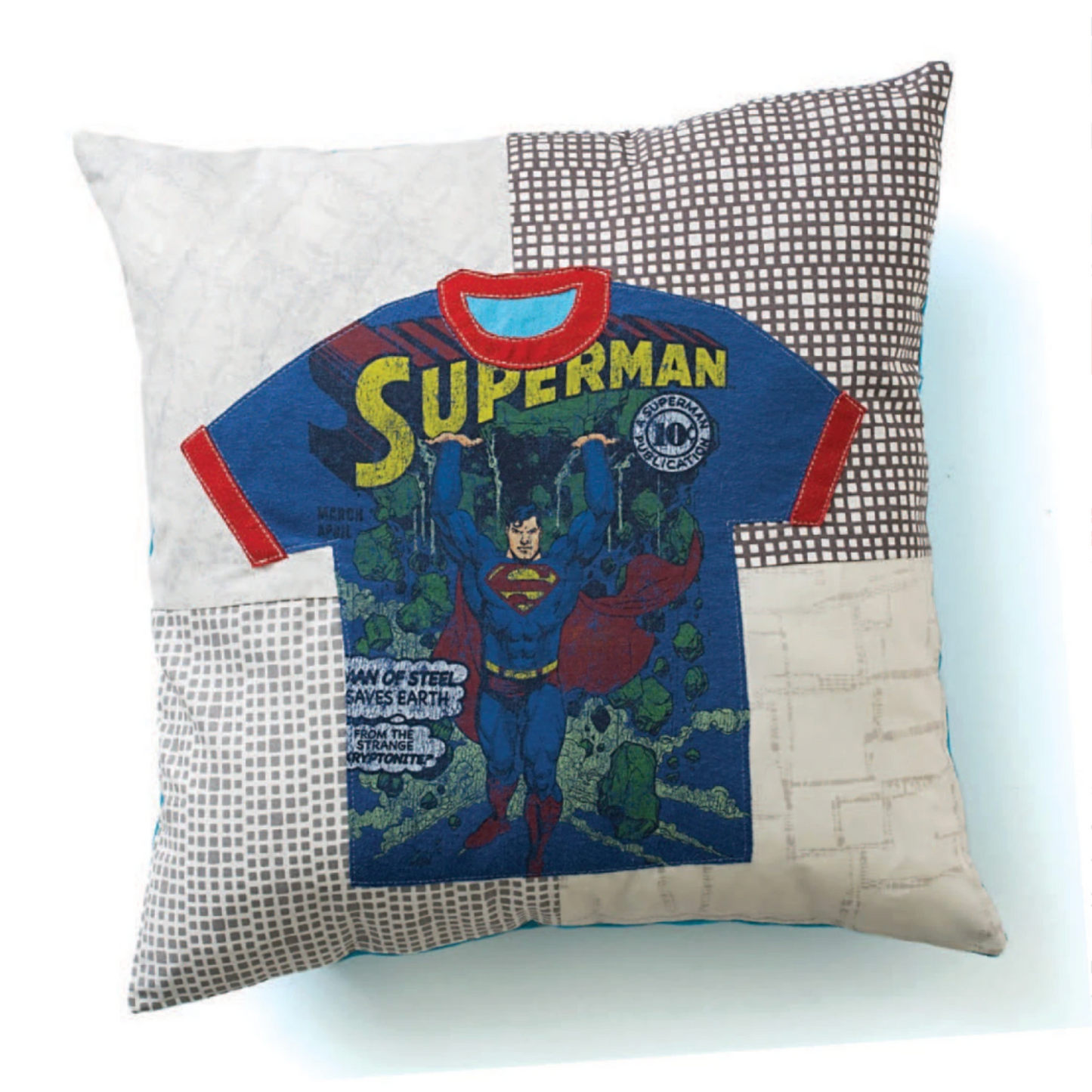Decorative pillow made from a vintage Superman T-shirt with patchwork background fabrics