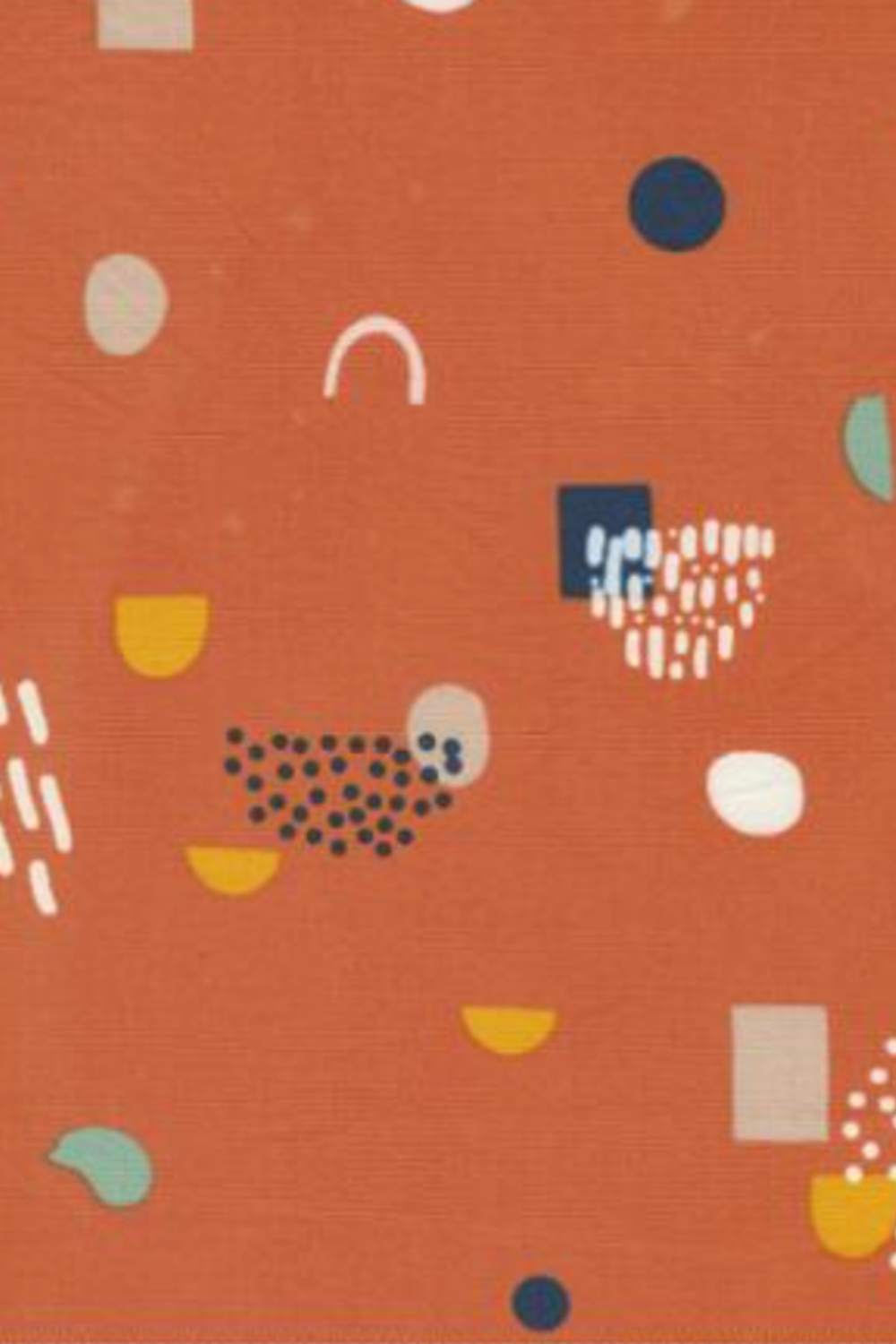 Close-up of Frisky Catch Me Cheeky fabric by Zen Chic for Moda Fabrics showing navy, mint, mustard, cream, and blush abstract shapes on a rust-orange ground