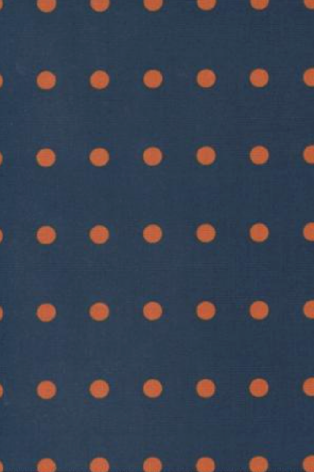 Close-up of Frisky In A Row Moody fabric by Zen Chic for Moda Fabrics – evenly spaced rust-orange dots in neat rows on a deep navy cotton ground. Available at IraRobi Quilts.