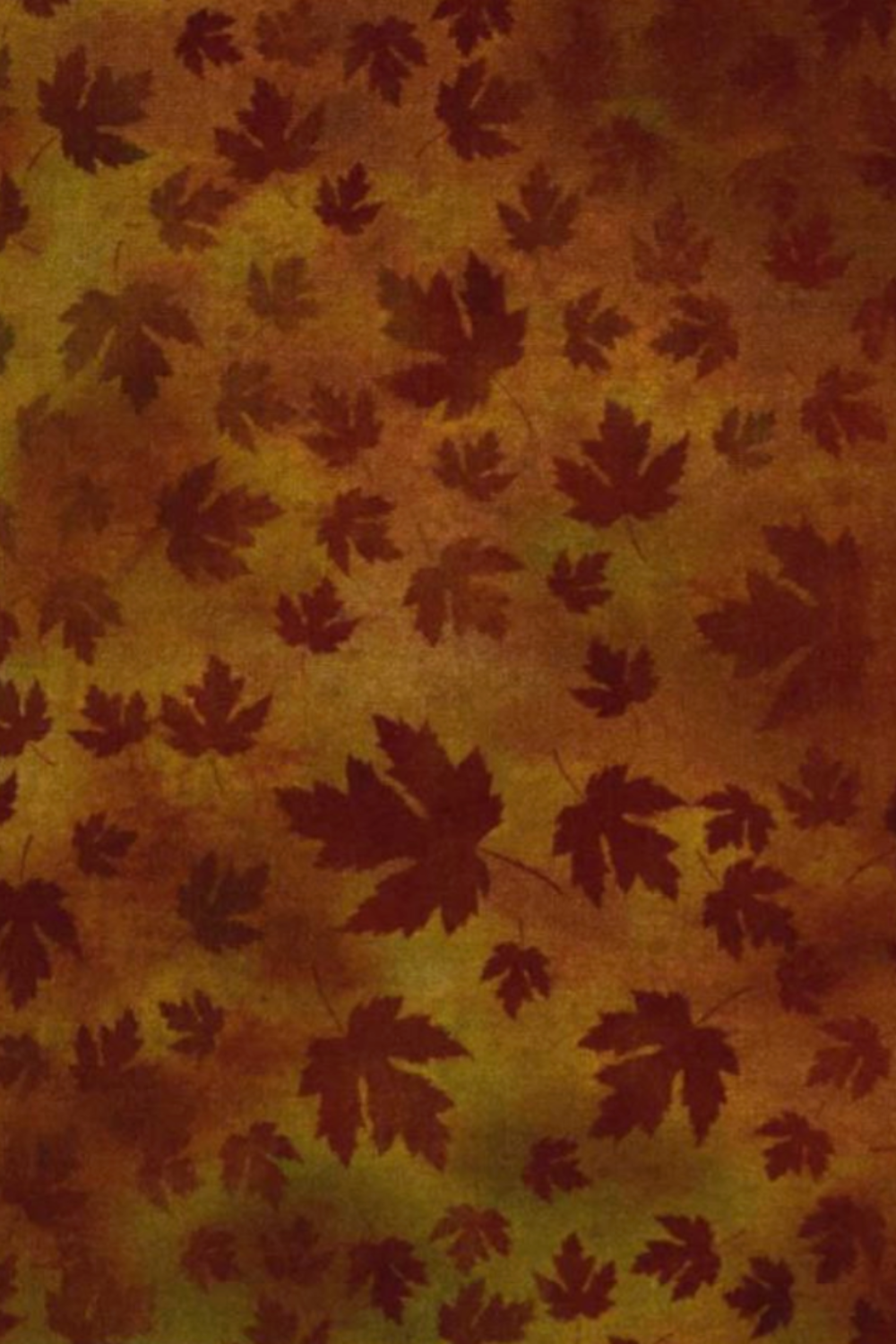 Autumn Celebration Brown Maple Leaves tonal blender fabric by Jason Yenter for In The Beginning Fabrics — dark burgundy maple leaf silhouettes scattered on a warm mottled amber and rust ground. Versatile fall coordinate for Thanksgiving quilts, table runners, and seasonal home décor. Available at IraRobi Quilts.