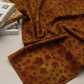 Autumn Celebration Brown Maple Leaves quilting cotton styled on cutting mat with quilting tools – lifestyle shot for quilters