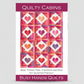 Quilt pattern cover with heart design and 'Quilty Cabins' branding