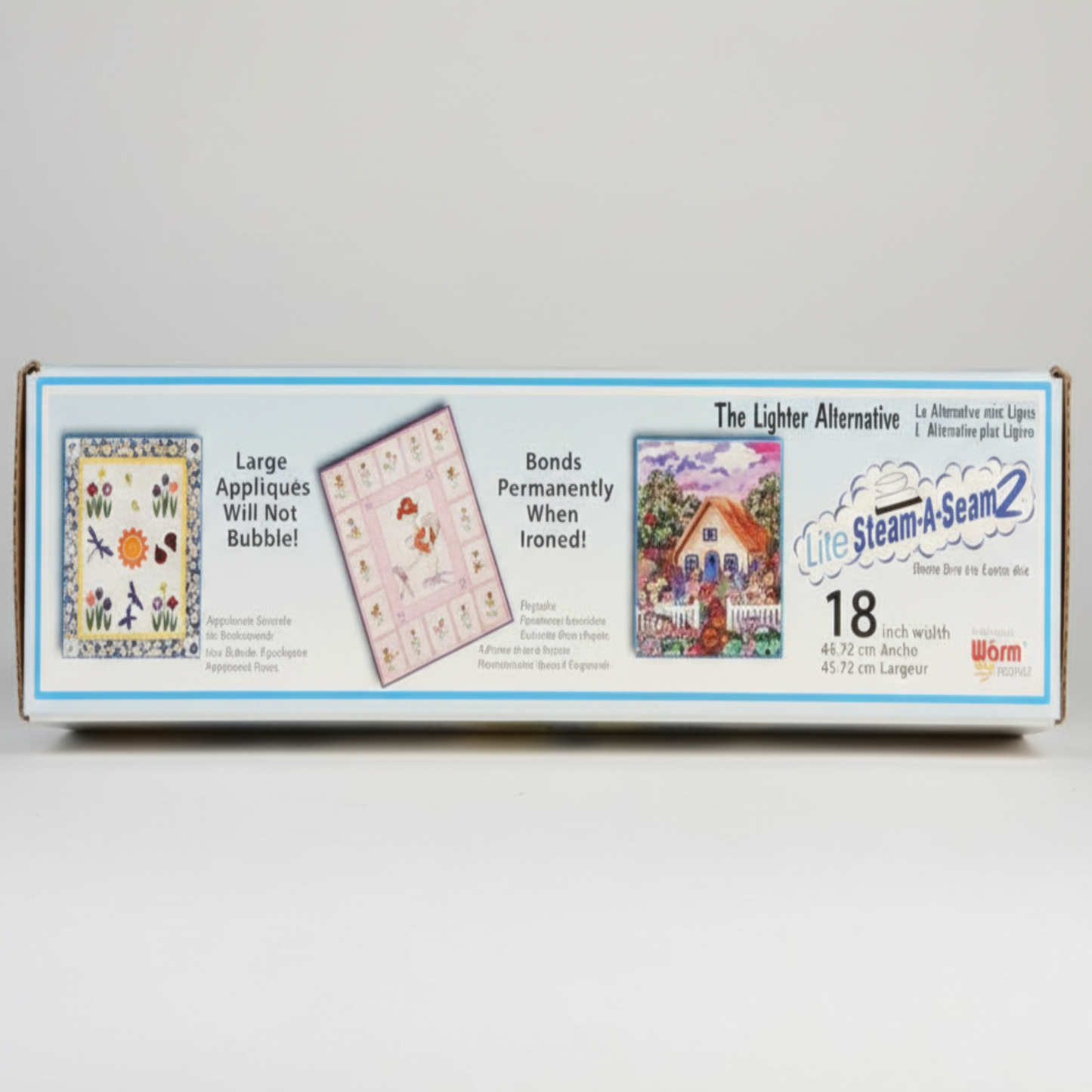 Steam-A-Seam 2 Lite fusible web box showing lightweight applique bonding and permanent iron-on results