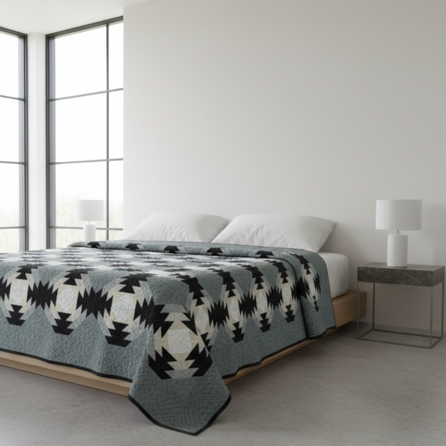 Geometric patterned rug with black, white, and gray colors on a light gray background