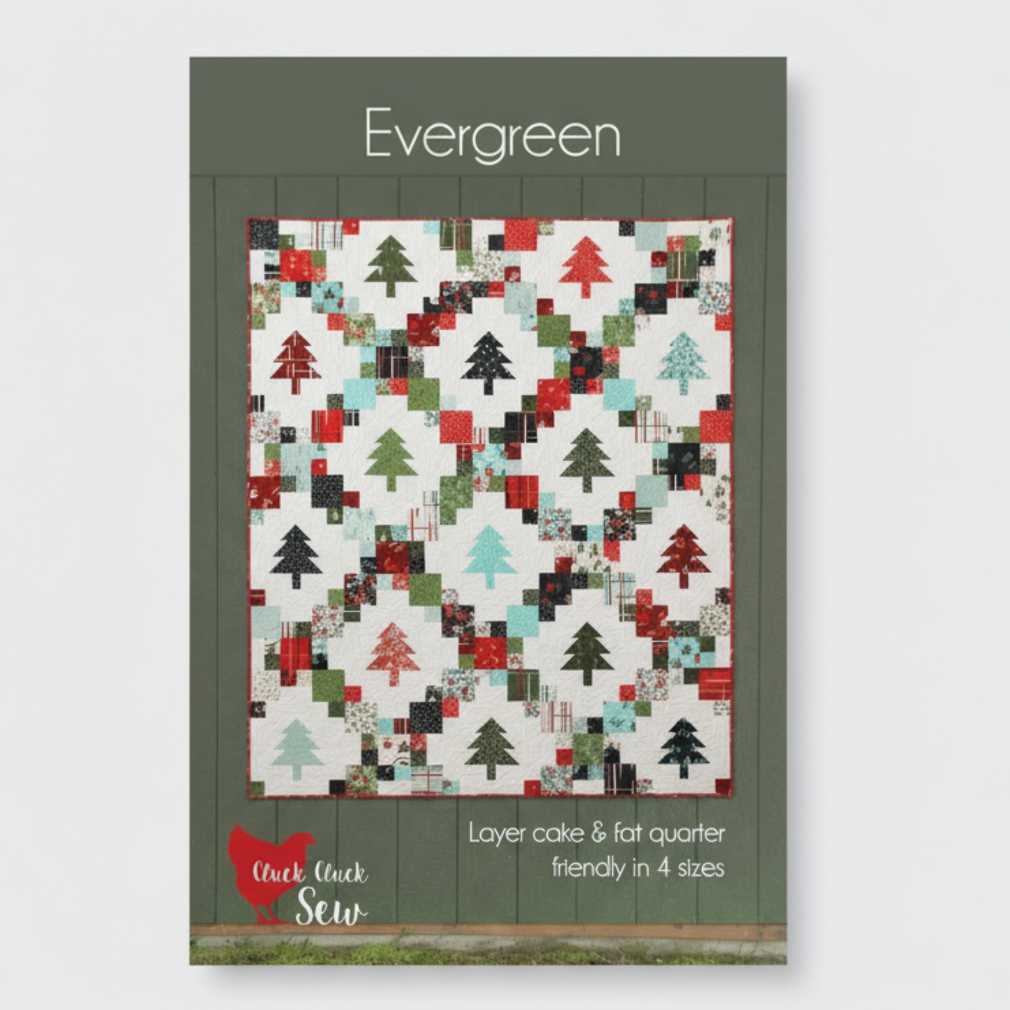 Quilt pattern cover with Christmas tree design on a white background
