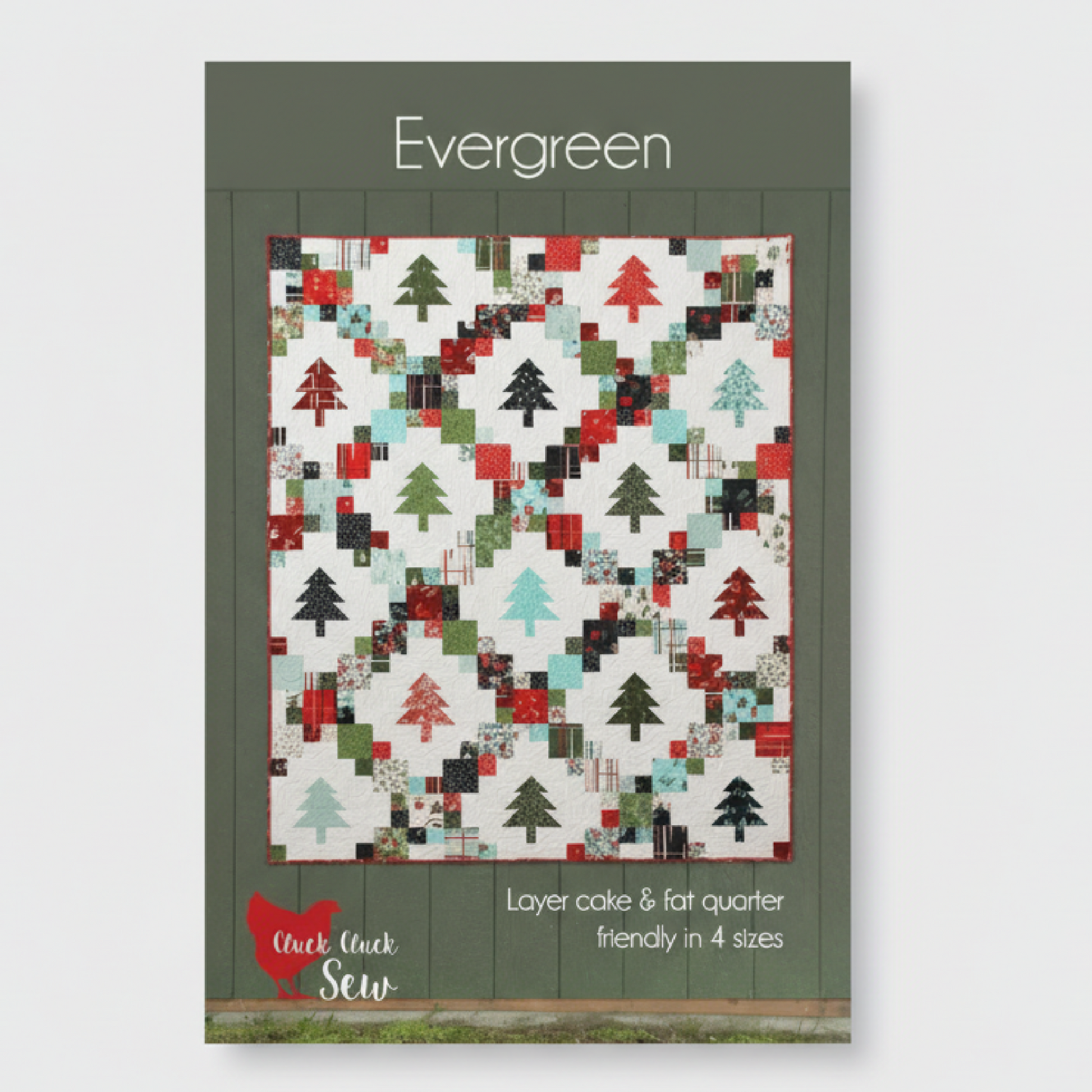 Quilt pattern cover with Christmas tree design on a white background