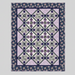 Quilt with geometric pattern on a gray background