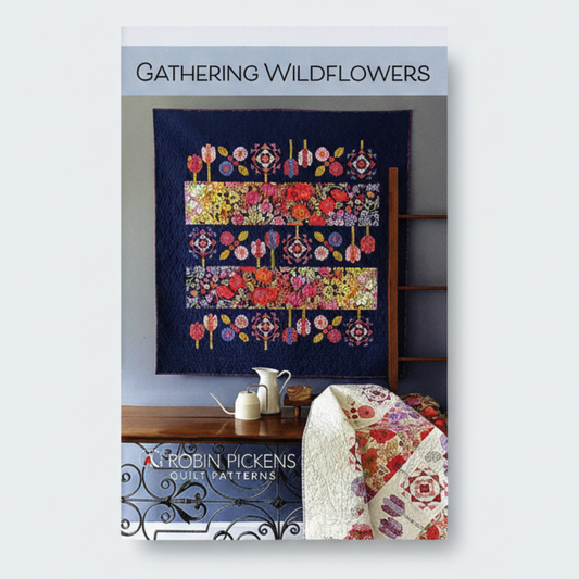 Quilt pattern book titled 'Gathering Wildflowers' by Robin Pickens with a colorful quilt displayed.