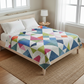 Colorful geometric quilt with a star pattern on a white background