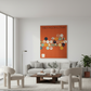 Modern living room with a gray sofa, coffee table, and chairs, featuring an orange abstract art piece on the wall.