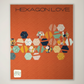 Framed artwork titled 'Hexagon Love' with colorful hexagonal patterns on an orange background.