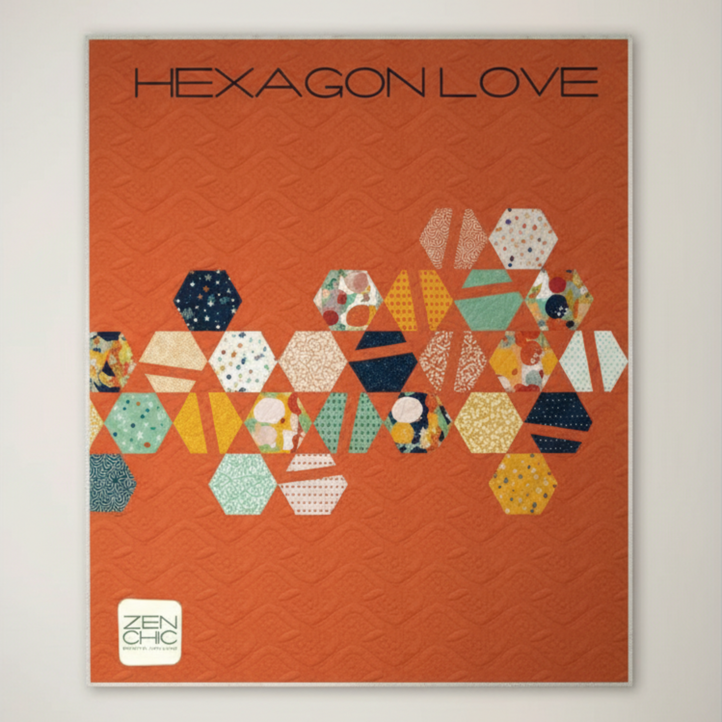 Framed artwork titled 'Hexagon Love' with colorful hexagonal patterns on an orange background.