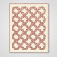 Quilt with geometric red pattern on a white background