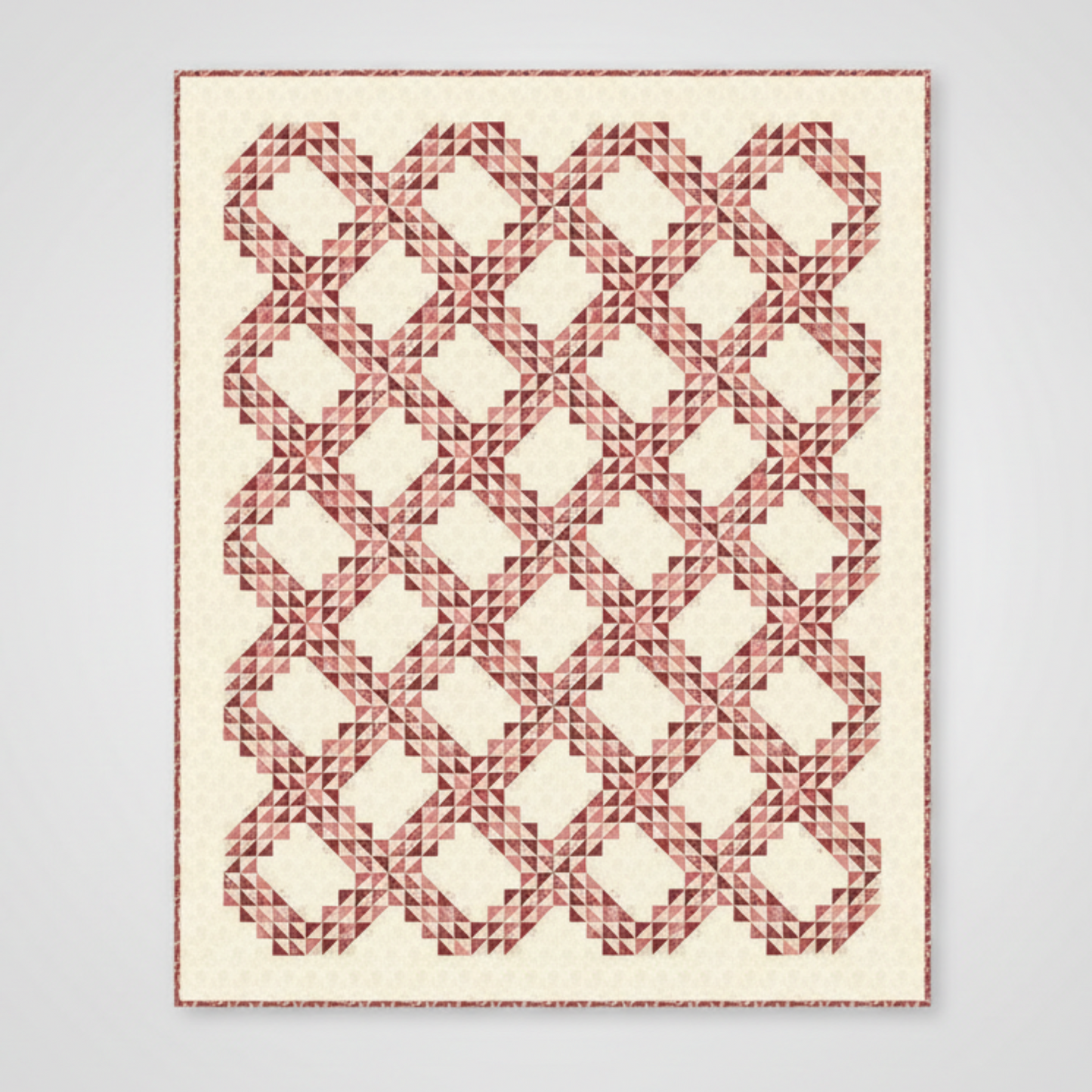 Quilt with geometric red pattern on a white background