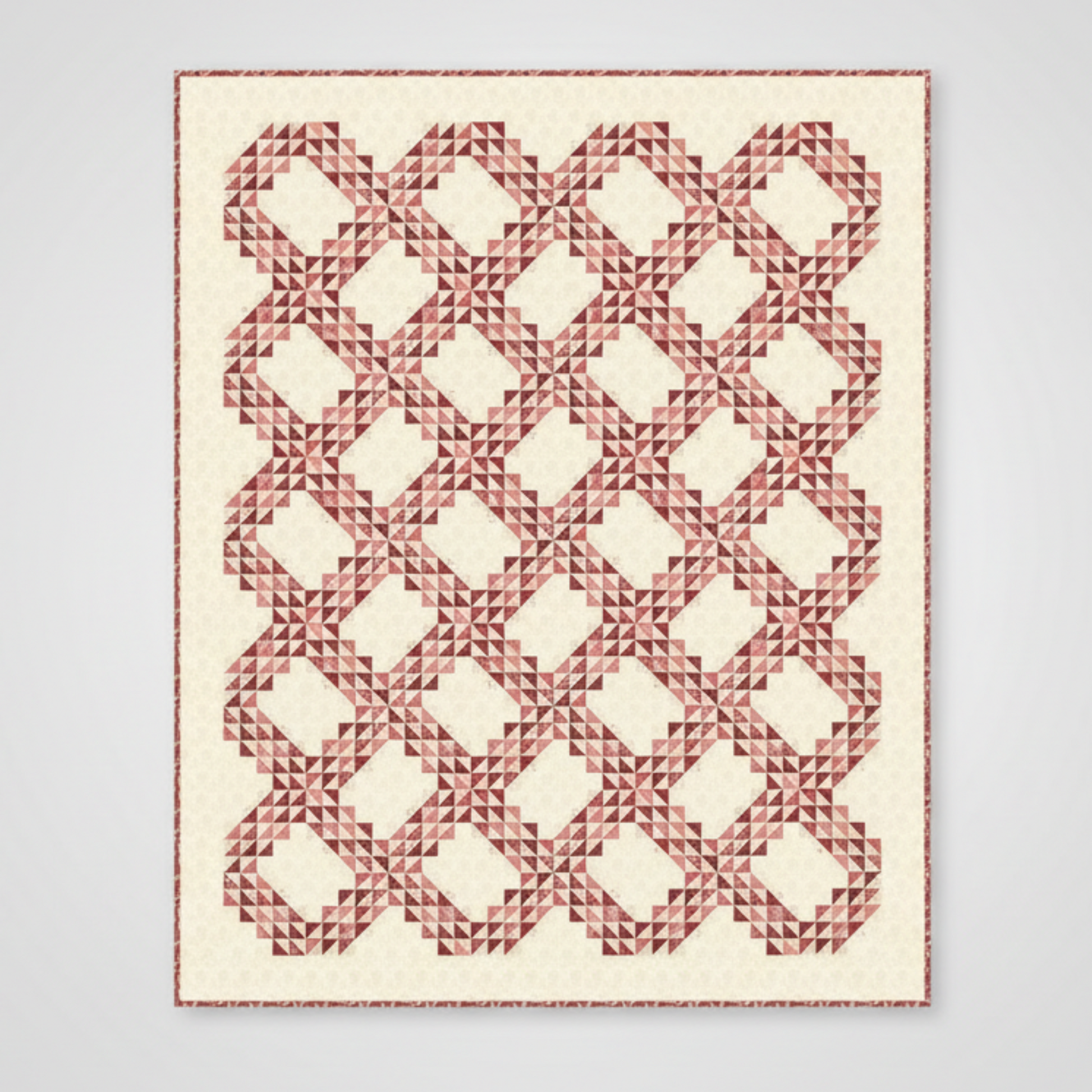 Quilt with geometric red pattern on a white background