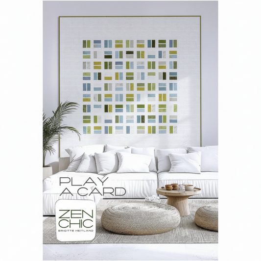 Modern living room with a framed abstract art piece on the wall, a white sofa, and decorative items.