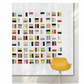 Colorful geometric patterned quilt on a white background with a yellow chair.