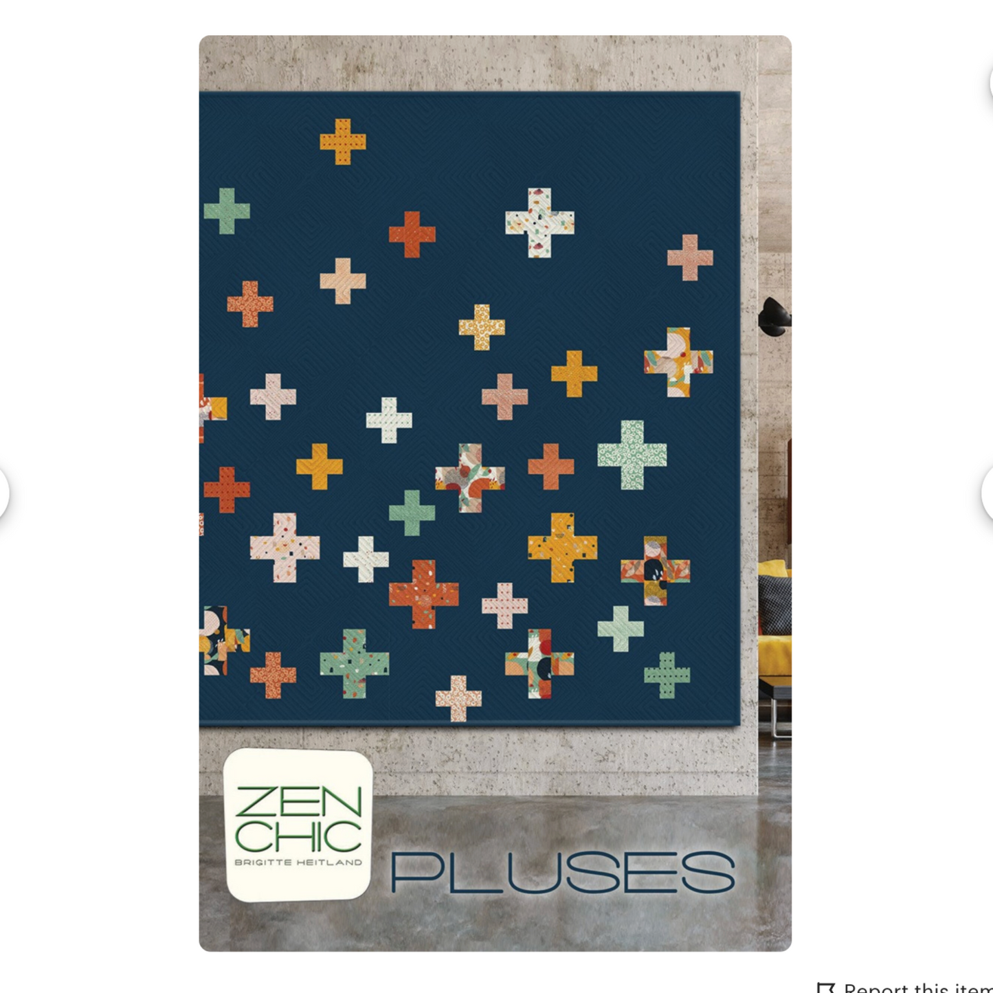 Quilt with colorful cross pattern on a blue background, branded 'Zen Chic'.