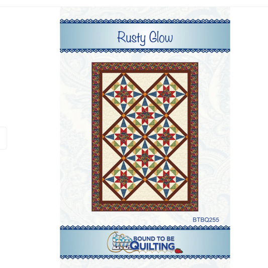 Quilt pattern packaging with star design and 'Rusty Glow' text on a white background