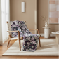 Quilt draped over a wooden chair in a room with a neutral color scheme.