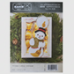 Snowman candle ornament packaging on a green leaf background